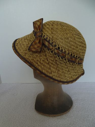 The hat band was made from a plaid silk taffeta piped with brown silk.  A bow and binding were made from the same fabrics.