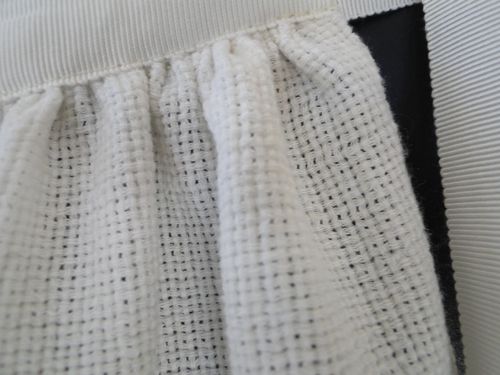 Detail of rough-weave silk and petersham ties.