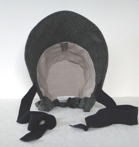 The bonnet is lined with cotton and also has a comb to keep it from sliding backwards.