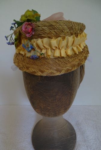 This 1870 hat is made of braided straw rescued from another hat that had been cut down.  The straw was hand stitched to a wired buckram base.
