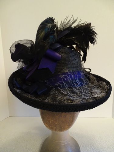 Grey veiling and black gimp further decorate this very theatrical hat.
