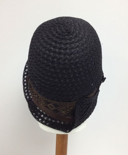 The braid was hand-stitched into the cloche shape over a wooden hat form.