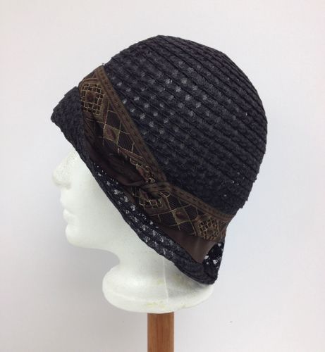 This hat was made for one of the cast members in the TV series Damnation, in 2017.  It's trimmed with a vintage Art Deco ribbon in black and brown.