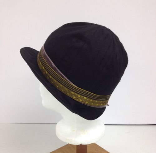 The hat band is made from two vintage ribbons.  The gold and black ribbon came from an on-line vintage store, and the mauve velvet ribbon is  a Herman Hendler original.
