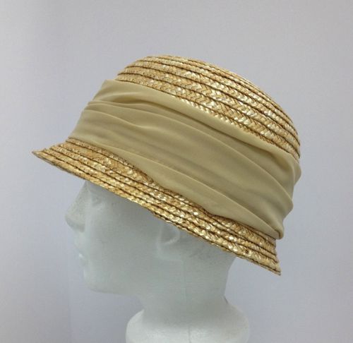 The crown was blocked using an existing hat and the brim was hand stitched into the narrow drooping shape.