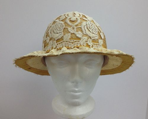 The front was trimmed with a vintage lace panel, and the underside of the brim was trimmed with petersham to hide the raw edges of the straw, which had to be cut down