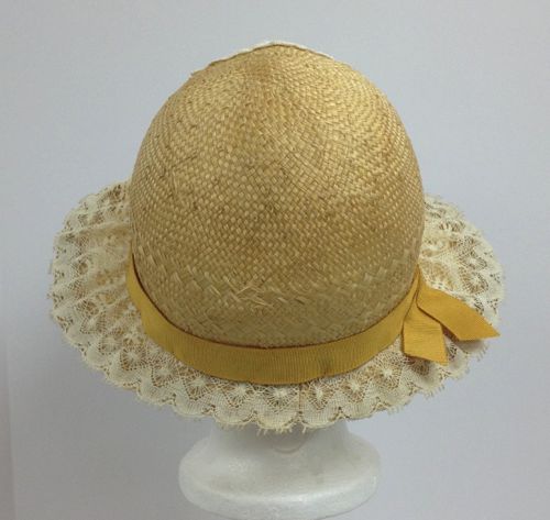 The cloche started it's life as a straw cowboy hat and was reblocked into the correct shape for the 1920's