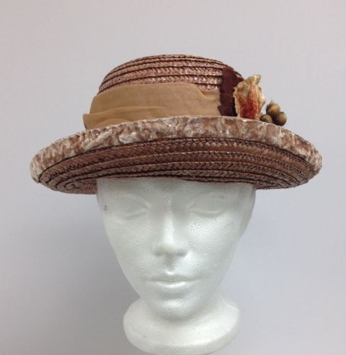The upturned brim is edged with vintage pink velvet ribbon that was crushed by hand to give the mottled texture.