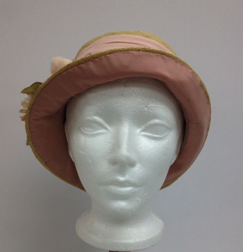 The brim, which can be worn turned up or turned down, is faced with pink silk taffeta