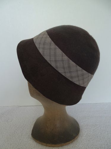 A plaid cotton fabric was cut on the bias to form a simple hat band.