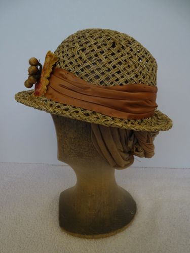 The hat band was made of vintage silk satin cut on the bias and pleated.