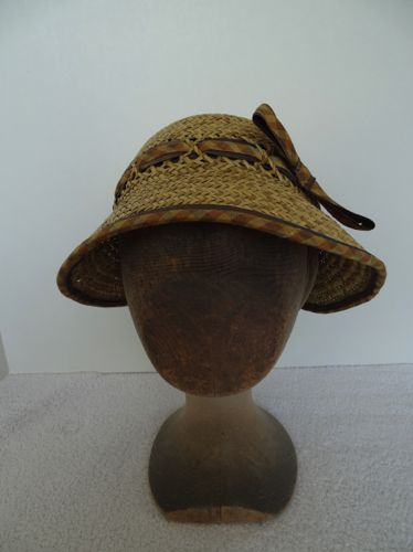 Front view of the straw cloche trimmed with silk taffeta.