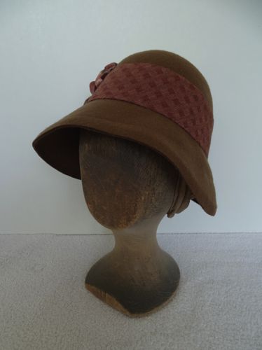 This wool felt cloche was redecorated for the pilot of the TV series Damnation in 2016.
