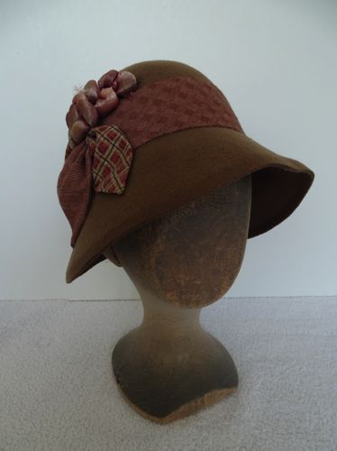 3/4 profile view of the wool felt cloche trimmed with calico.
