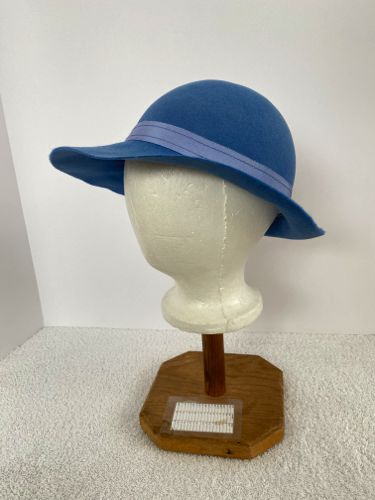 The outer hat band is made from a lighter blue Petersham ribbon that has been topstitched.