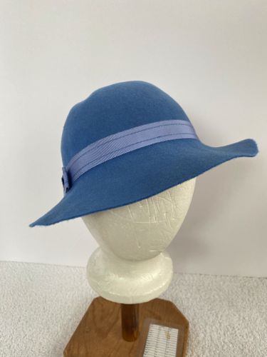 This sky blue felt slouch hat has the shallow crown and slightly wavy brim commonly associated wit the early 1930's