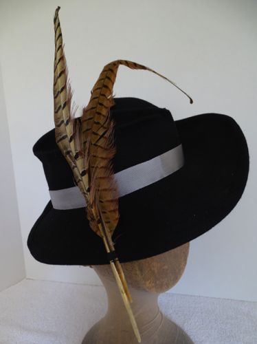 The crown of the hat has been hand stitched into small pleats to give interest.  The hat band is made of silver grey petersham ribbon.