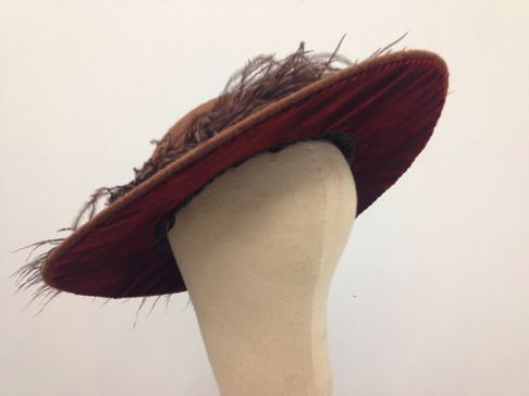 Originally made for the Disney movie "Togo" this buckram hat is covered with a  rusty-brown tweed fabric on the topside, and velvet underneath.