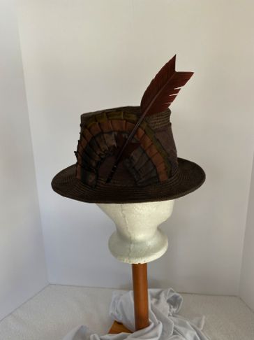The crown was blocked on a vintage wooden hat block and the brim was shaped in the hand.