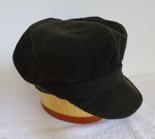 A soft corduroy newsboy cap in a very dark green. Size 7 1/2, or 23 3/4".