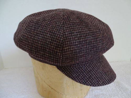 A tattersall plaid newsboy cap in wine, taupe, and grey.  Size 7, or 22 1/4". $75 CDN