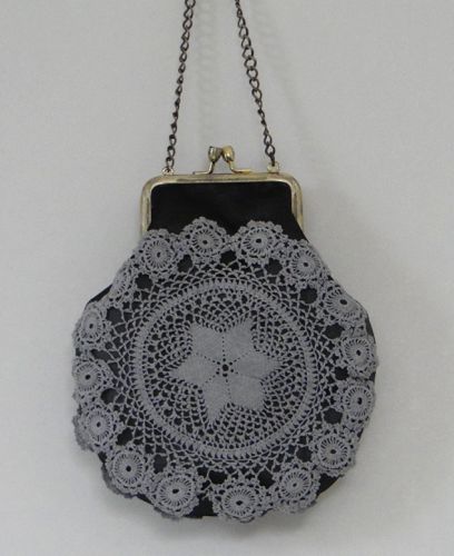 Purse with metal frame made from hand-dyed doilies and lined with steel grey taffeta, metal chain, 2013.