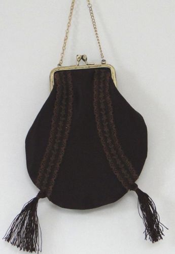 Metal framed purse of brown velvet trimmed with lace and tassels, metal chain made for “Hell On Wheels” 2013.