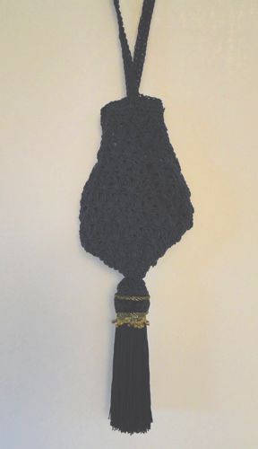 Navy crochet purse with gold-trimmed tassel made for Jann Arden in “Hell On Wheels” 2014.