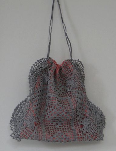 Drawstring purse from a hand-dyed doily, lined with pink satin made for “Hell On Wheels” in 2013.