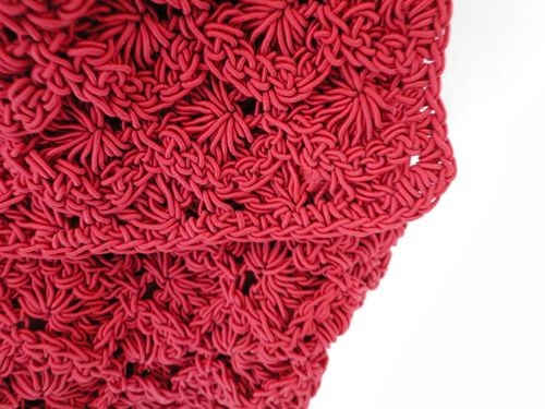 Detail of red crochet purse.
