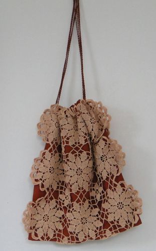 Drawstring purse of crochet lace lined with silk, made for “Hell On Wheels” in 2013.