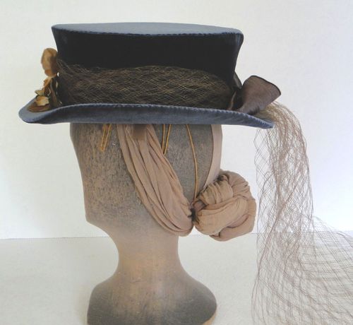 The side view shows off the vintage netting as well as the wires, horsehair, and elastic used to hold the hat firmly in place.
