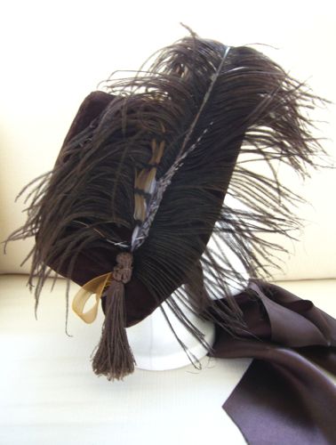 Right side is trimmed with ostrich and pheasant feathers plus a handmade tassel.