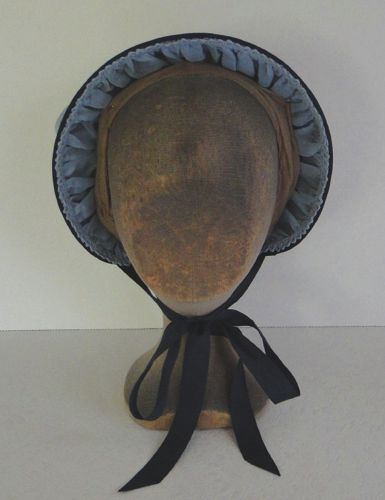 This felt bonnet started it's life as one from the Amazon Drygoods Factory.