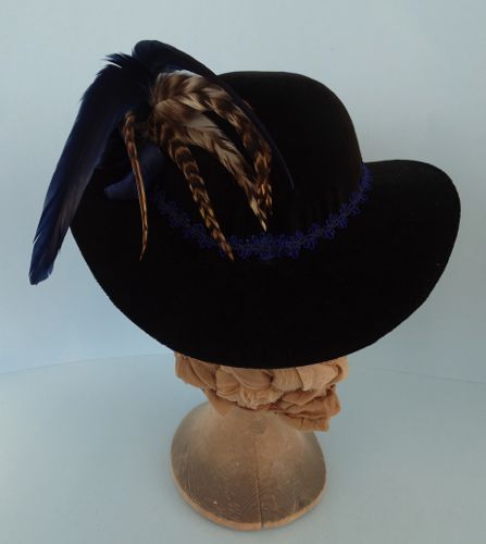The back of the hat shows the ends of the feather trims.