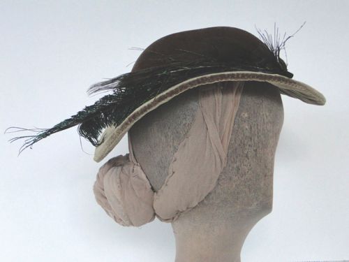 This round hat has a flared brim that allows light on the face.