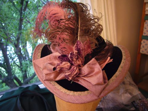 The trims of Mrs. Durant's hat are pinned in place to show the costume designer.