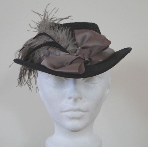 Riding hat made for “Hell On Wheels” 2013.  Buckram frame covered with dark brown tweed, satin bows.