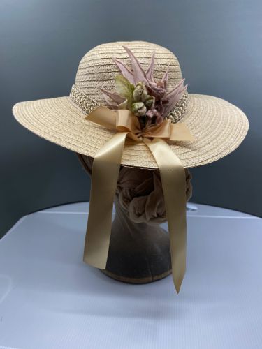 The back of the hat has a bouquet of vintage millinery flowers, and some "trailing ribbons" with a bow.