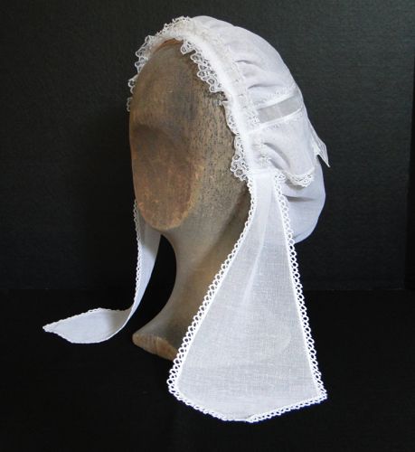 White day cap with lace trimmed lappets has delicate lace trim around the front.  This style was worn from about 1862-64.