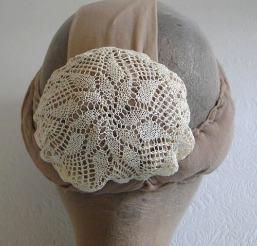 Detail of the lace doily that was used to make this cap.