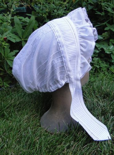 Made from an illustration in Godey's Lady's Book in 1864, this white cotton cap is made from a pin-tucked fabric.