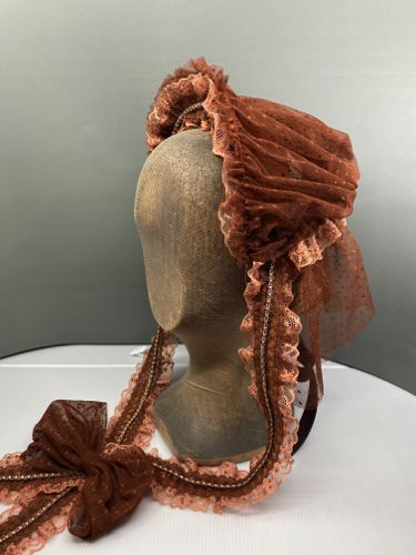 This headdress was made from an image in an historic fashion book.  It's built on a very small buckram and wire frame that was covered with Taffeta.