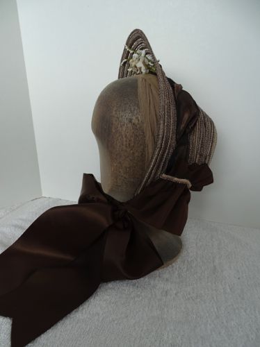 Left side view from a distance shows the ties as well as the curtain.  The curtain is made from a 5" wide vintage taffeta ribbon in brown.