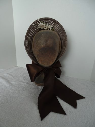 This 1864 Spoon bonnet was made in 2018 from synthetic straw salvaged from a thrift store sun hat.