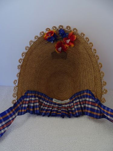 This inside view shows the small bouquet that adorns the centre of the brim, as well as the comb that helps keep it in place.