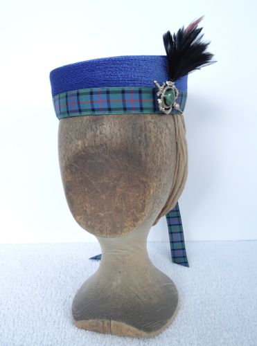 This blue straw hat is reminiscent of the Garrison Cap style that became popular after 1863.