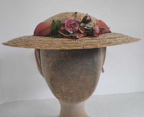 This straw round hat was made for the character of "Ruth" in "Hell On Wheels" in 2014.  The front is trimmed with pink roses.