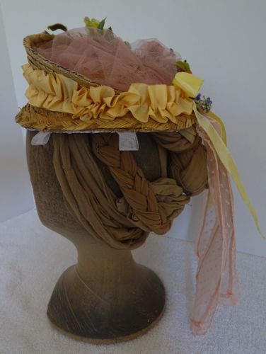 The crown is filled in with a soft pink tulle.