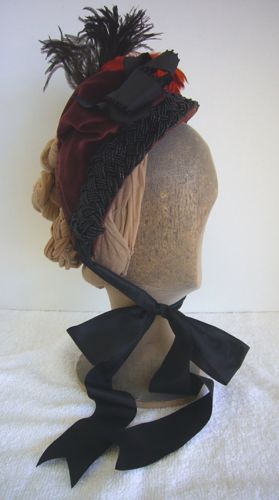Typical of the mid 1880's, this bonnet is quite small, and emphasizes height to balance the bustle-style gown it was worn with.